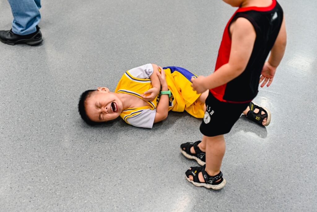 Child in pain due to an injury. First aid training to know how to manage and care for children